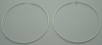 Big pendant earring in circle of smooth thin wire.