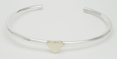Bracelet of thin  tube with brass heart