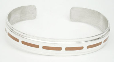 Thin bracelet with lines of orange resin