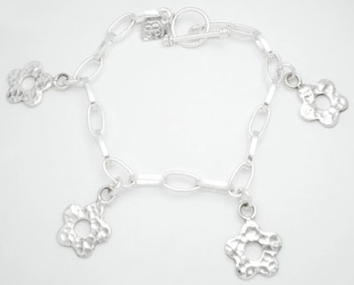 Bracelet with pendant of hammered flower