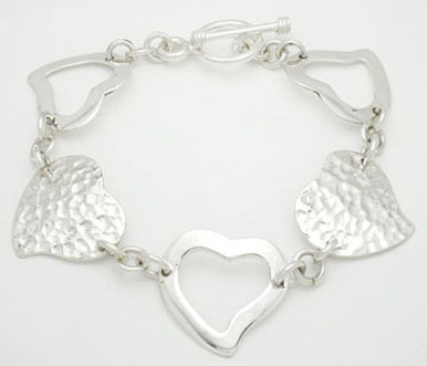 Bracelet of perforated and hammered hearts