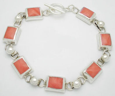 Bracelet of squares of pink shell with spheres