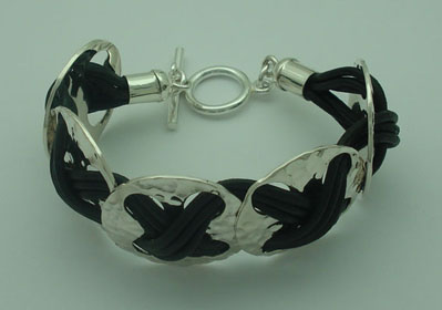 Bracelet of circle soaked with black leather