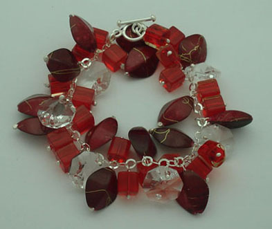 Bracelet of buckets and  pipe s of red crystal