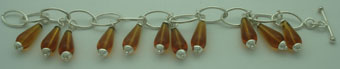 Bracelet drops of synthetic amber oval links