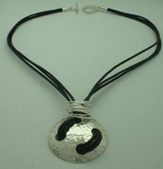 Necklace of hammered circle and eleven rings black leather