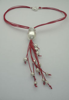 Necklace egg with red threads