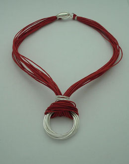 Necklace of hoops linked with red threads
