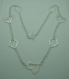 Necklace of 3 hearts and 3 perforated rhombs