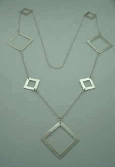 Necklace of 3 smooth big rhombs and 4 small rhombs linked with chain.