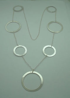 Necklace of 3 smooth big circles and 4 hammered boys linked with chain