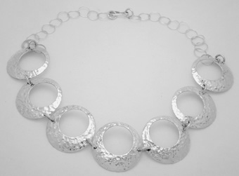 Necklace of hammered and perforated circles