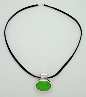 Oval necklace with plastic green and black deerskin