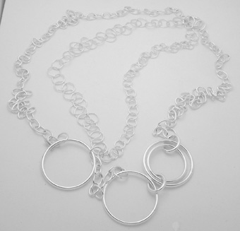 Long necklace of circles and rings