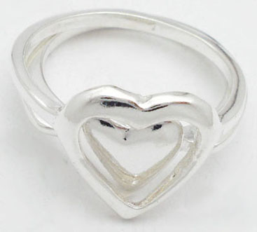 Double ring with smooth and perforated heart
