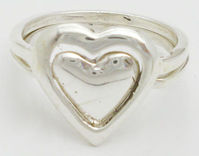 Double ring with smooth and perforated heart