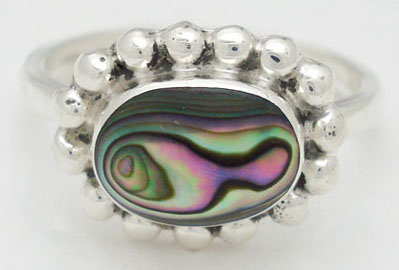 Ring with shell and spheres in oval