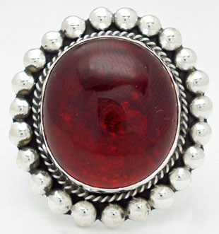 Ring with glass red roundly, torsal and spheres