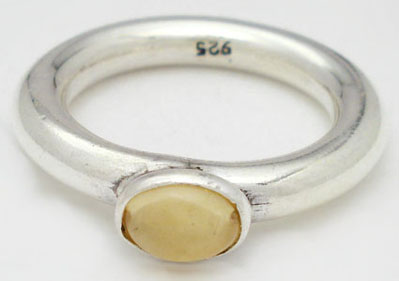 Ring with oval orange glass of thick  tube