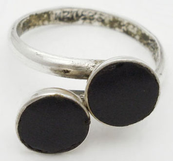 Ring with 2 circles of black plastic