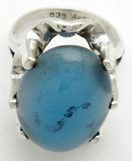 Chrysocolla ring with 6 or grasp in oval