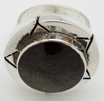 Obsidian ring in circle boarded with V