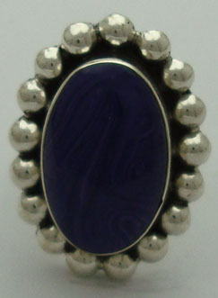 Oval ring with spheres and purple synthetic stone