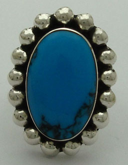Oval ring with spheres and stone turquoise