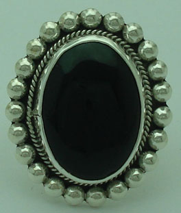 Oval ring with spheres and onyx