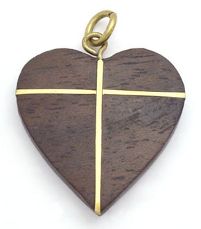 Pendant of wooden heart with brass cross