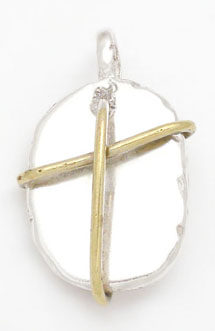 Oval pendant with brass cross