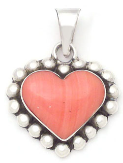 Pendant of heart of red glass with spheres