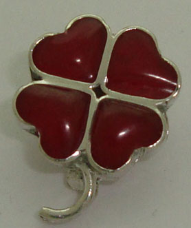 Pendant of clover with red resin