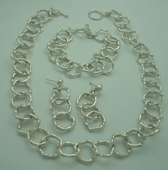 Set of wavy rings necklace, bracelet and earrings