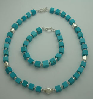 Set of buckets of turquoise with squares and circle