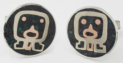 Cufflinks of Chrysocolla regions with face of brass and copper