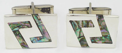 Cufflinks in rectangle with shell lines
