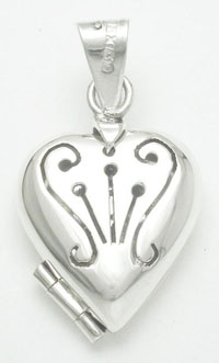 Pendant   heart reliquary with curls carved