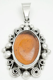 Pendant   amber oxidized with sphere  oval and spirals