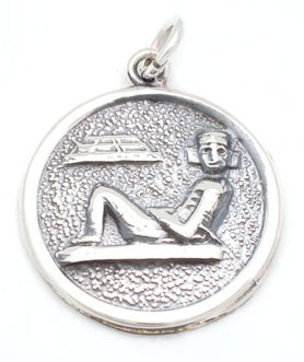 Pendant   round with  pyramid  and Egyptian