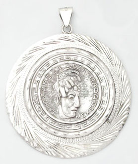 Pendant  on head in currency with drops and frets