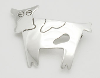 Brooch cow with soaked spot