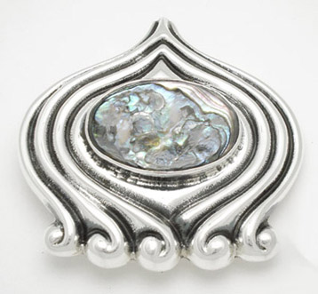 Brooch oval with curl to the sides shell